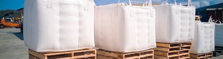 Tapioca in jumbo bags on pallet to prepare for stuffing in container.